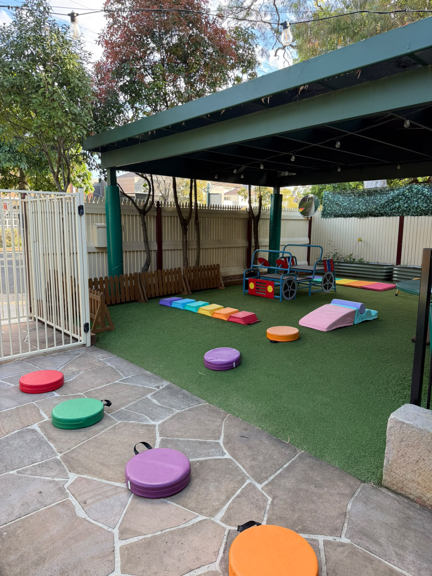 Covered outdoor play area at Little Woods Early Learning in Glebe, shaded for all-weather play